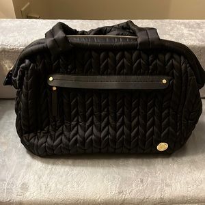 A black HAPP Brand Diaper Bag. Perfect condition.